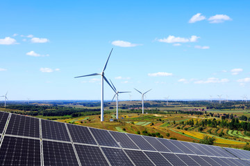Solar photovoltaic panels and wind turbines.
