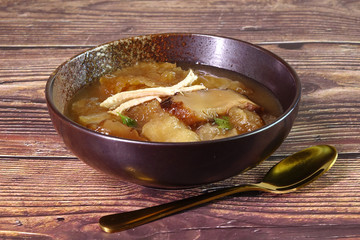 Braised Fish Maw in Red Gravy, famous Hakka cuisine in China, Hong Kong, Taiwan, Thailand. In Chinese food culture, fish maw is a type of food that promotes longevity or wondrous health benefits.