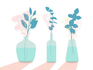 Fototapeta na wymiar three glass vases with flowers