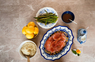 Turkey Ham Dinner Served on Blue and Yellow Dishes