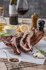 Grilled pork ribs with mashed potatoes placed on a wooden table