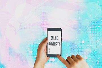Text sign showing Online University. Business photo showcasing Distance Learning Courses are taken...