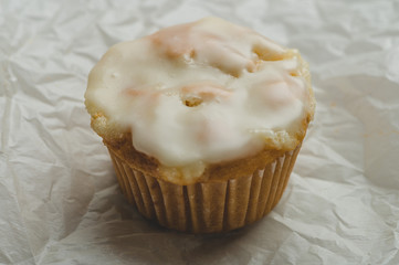 Glazed Calamansi (Calamondin) Moist Muffins- Close Up on Parchment Paper Solo