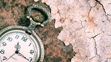 Vintage pocket watch showing time with textured background. concept of time