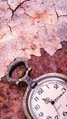 Fototapeta na wymiar Vintage pocket watch showing time with textured background. concept of time