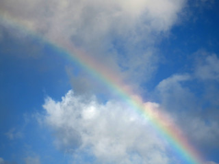 Fototapeta na wymiar Hawaiian Rainbow over a cloud
