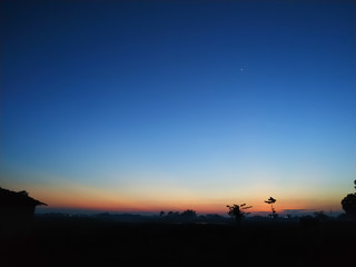 Fototapeta na wymiar sunset in the mountains blue sky plant