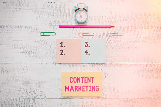 Writing note showing Content Marketing. Business concept for Involves the creation and sharing of online material Blank notepads clips marker small alarm clock wooden vintage background - Powered by Adobe