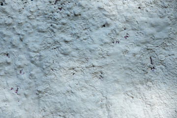 White stone wall texture with shotcrete painted white
