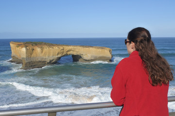 Woman looking at the landscape view of London Bridge Port Campbell National Park Victoria Australia