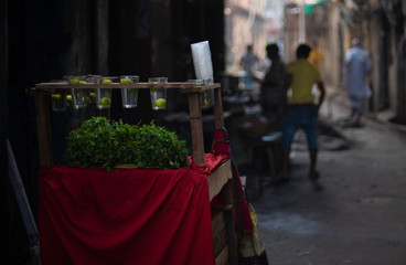 A local street stall selling lemon and mint juice in the street in a summer morning. Indian lifestyle and street.