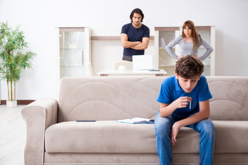Concept of underage smoking with young boy and family