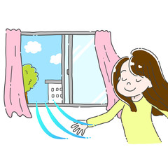部屋の換気をする女性