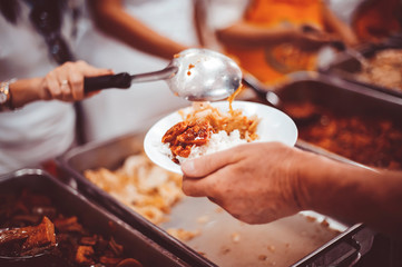 feeding to hand the poor helping  beggar in social, Poverty concept