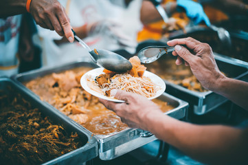 feeding to hand the poor helping  beggar in social, Poverty concept