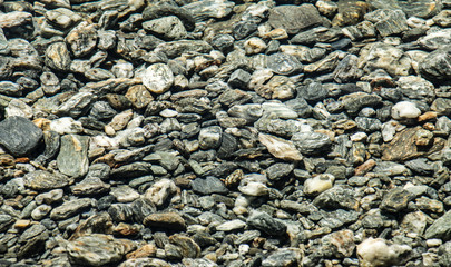 Natural background pattern of river pebbles