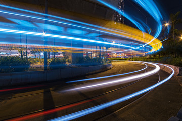 Fototapeta na wymiar light trails of car on road in downtown at night. Traffic background