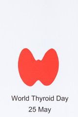 Red thyroid shape and inscription World Thyroid Day 25 May. Problems with thyroid concept. Place for text