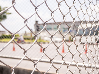 Wire fencing beside each other, the line between the road and the canal