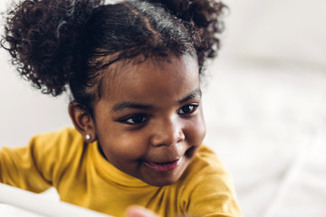 Portrait of happy smiling little child african american girl