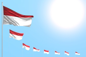 wonderful many Indonesia flags placed diagonal with bokeh and empty place for content - any feast flag 3d illustration..
