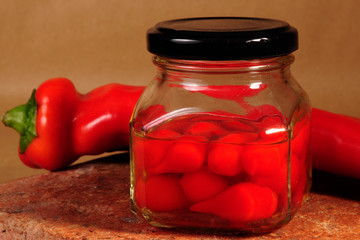 red peppers in glass jar