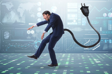 Businessman losing energy to work