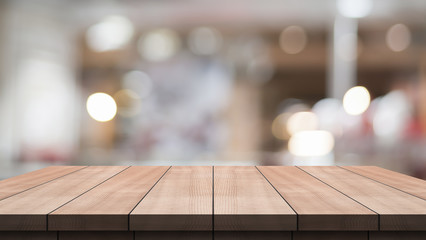 3D Rendering, Wooden top table with bokeh light effect and blur restaurant on background, blur background