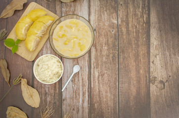 Sticky rice with durian(top view) on a wooden background.