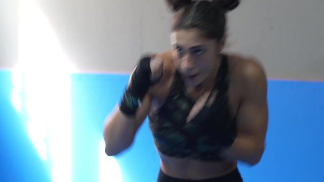 Professional woman is practicing shadow boxing