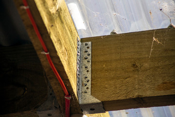Close-up detail of webs on wood framing