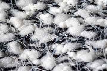 White and black thread wool, close-up.