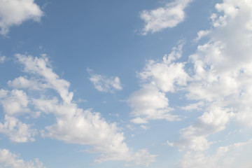 Blue Sunny sky, white Cumulus clouds lower layer of cloud cover, sky background .