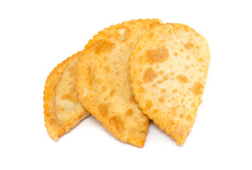 Juicy chebureki pies isolated on a white background.