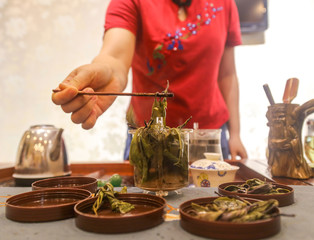 Brewing Chinese tea from the tea leaves.