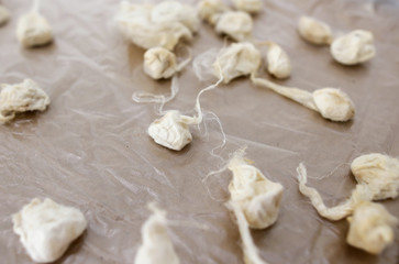 Fototapeta na wymiar Silkworm cocoon in silk threads.