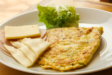 Omelet with cheese and salad