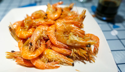 Grilled shrimp on a table in a restaurant.