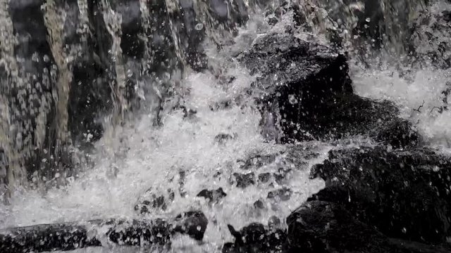 water splash on stones in slow motion 180 fps