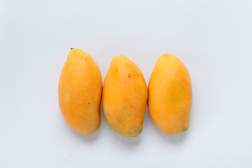 Naklejka na ściany i meble Mangoes on a white background