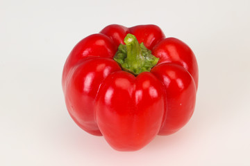 Ripe red bell pepper isolated on white