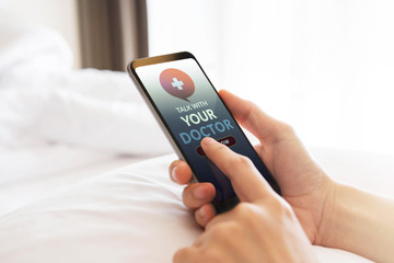Helathy Lifestyle and Technology Concept. Modern Person Using Online Medicine Application via Mobile Phone to Request a Consultation from the Doctor about their Health