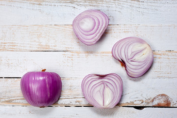 Red onion, lettuce. Health benefits, very rich in vitamins. Background for vegetables and garden plants and cooking.
