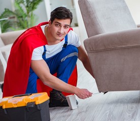 Super hero repairman working at home