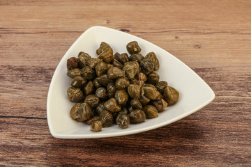Tasty capers in the bowl