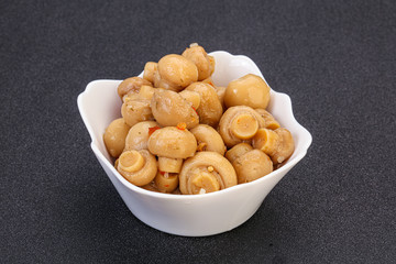 Pickled champignons in the bowl