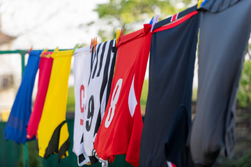 Colorful clothes hanging to dry on a laundry line