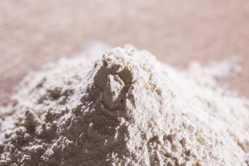 Fototapeta na wymiar White flour on textile background texture photo