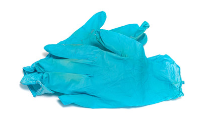 Used blue rubber gloves on a white background.