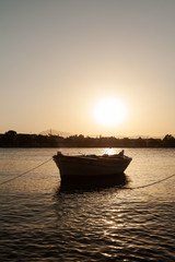 fishing boat at sunset, boat on the water, boat on the sea